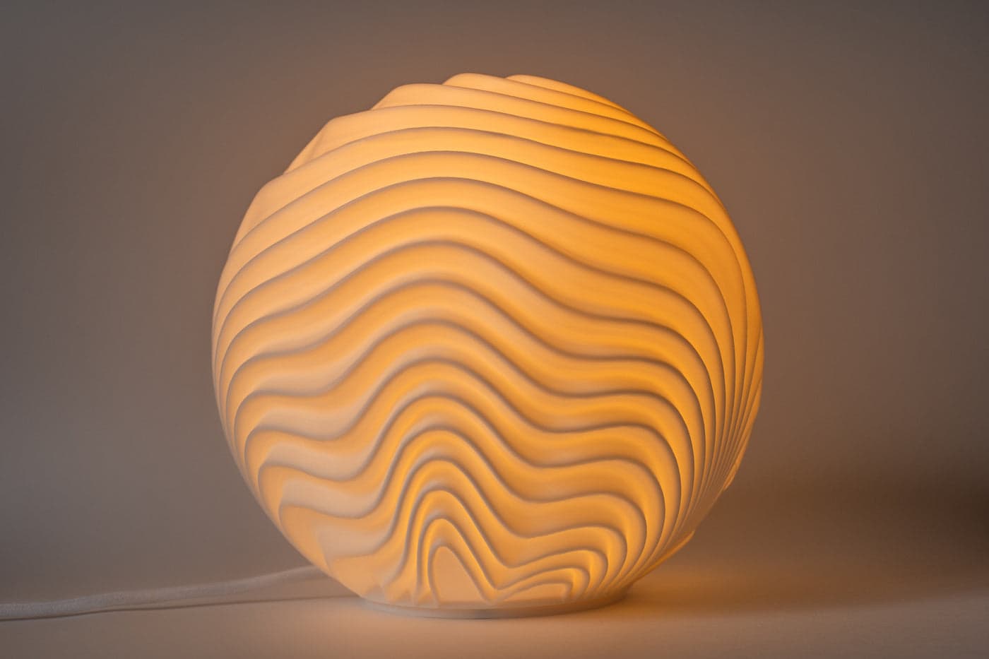 Dune lamp, lit, close up